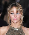 Jennifer_Lawrence_at_the_London_premiere_of_The_Hunger_Games_begging_for_an_Oscar_in_a_gold_dress_056.jpg