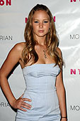 A picture of Jennifer Lawrence from the launch party of Nylon Magazines TV Issue. Tight white dress.
