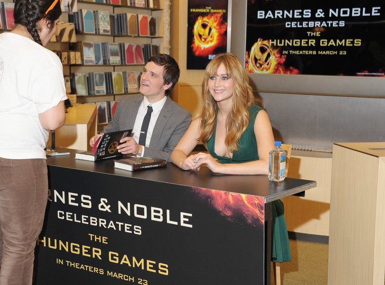 Jennifer_Lawrence_wearing_a_cute_low_cut_green_dress_at_a_book_signing_for_The_Hunger_Games_59.jpg