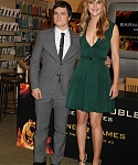 Jennifer_Lawrence_wearing_a_cute_low_cut_green_dress_at_a_book_signing_for_The_Hunger_Games_23.jpg