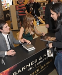 Jennifer_Lawrence_wearing_a_cute_low_cut_green_dress_at_a_book_signing_for_The_Hunger_Games_57.jpg