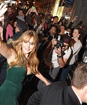 Jennifer_Lawrence_wearing_a_cute_low_cut_green_dress_at_a_book_signing_for_The_Hunger_Games_60.jpg