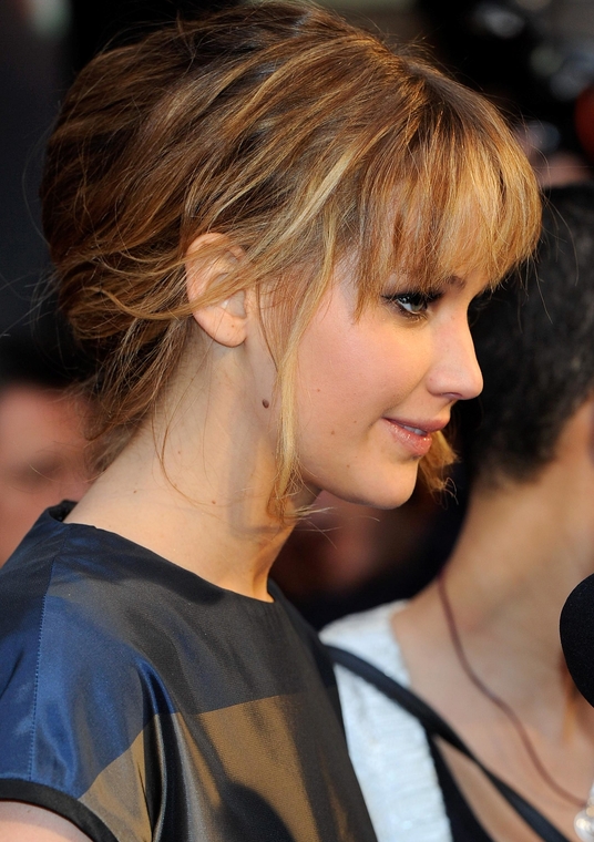 A side view of  Jennifer Lawrence on the red carpet.
